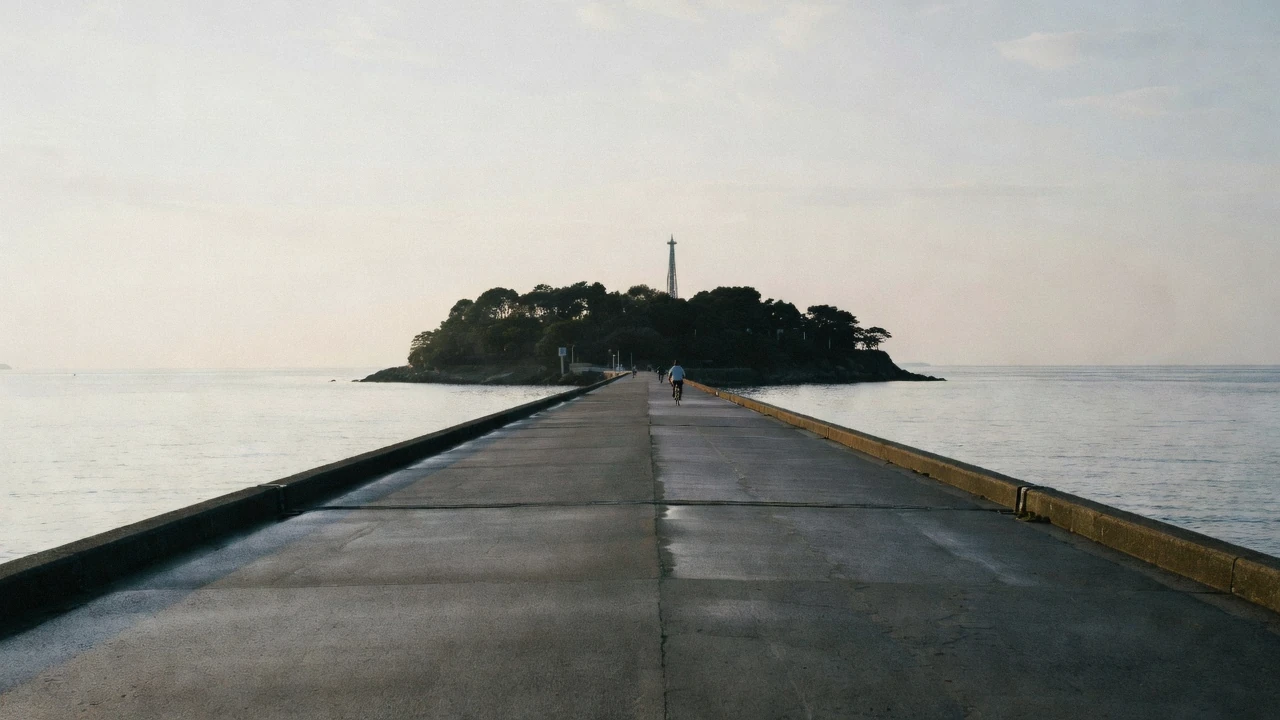 The bridge to Enoshima island with the observation tower on the hill above, seen on an Enoshima day trip from Tokyo, Kanagawa Japan